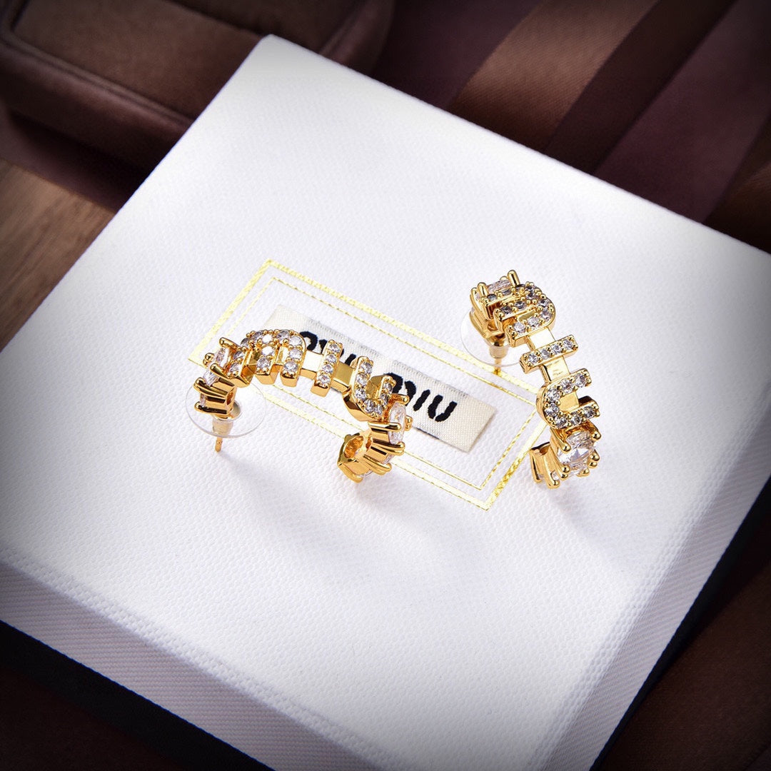 MM rounded logo earrings in gold