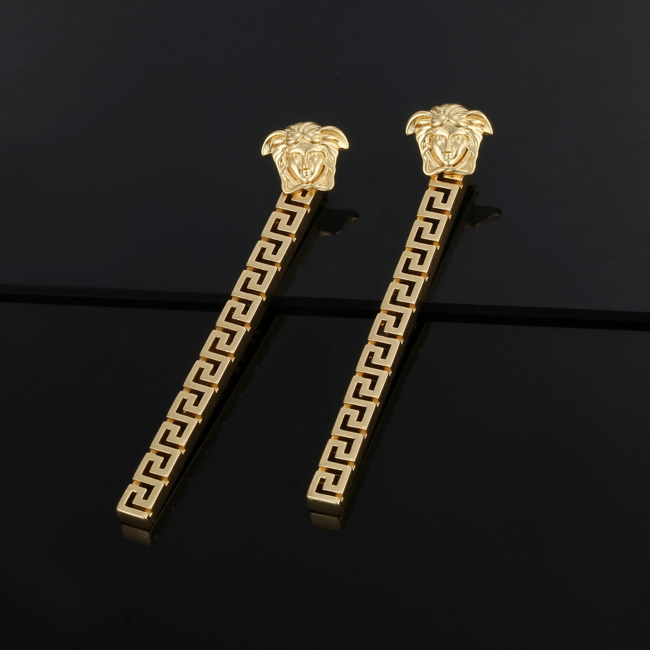 V gold earrings
