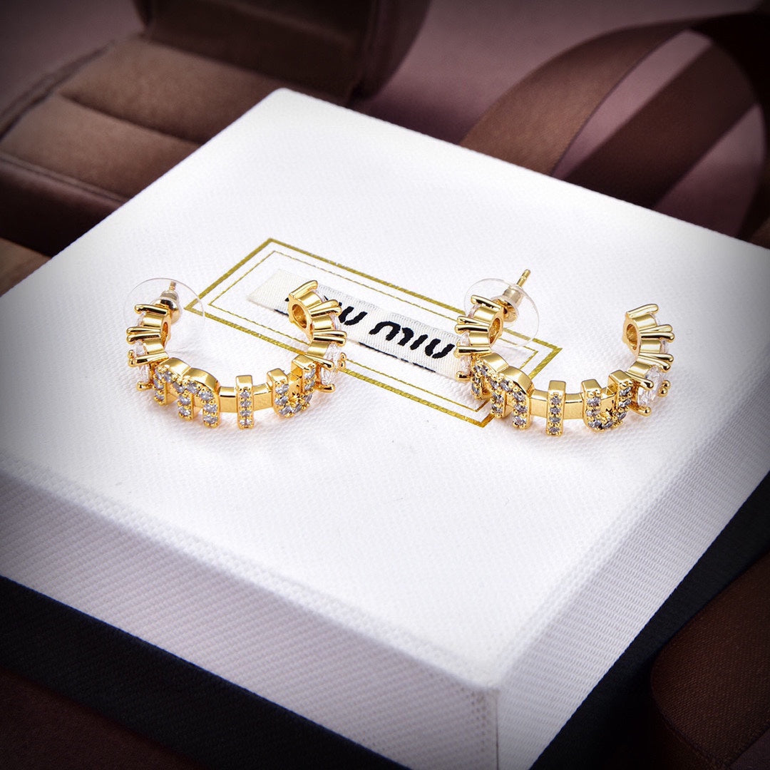 MM rounded logo earrings in gold