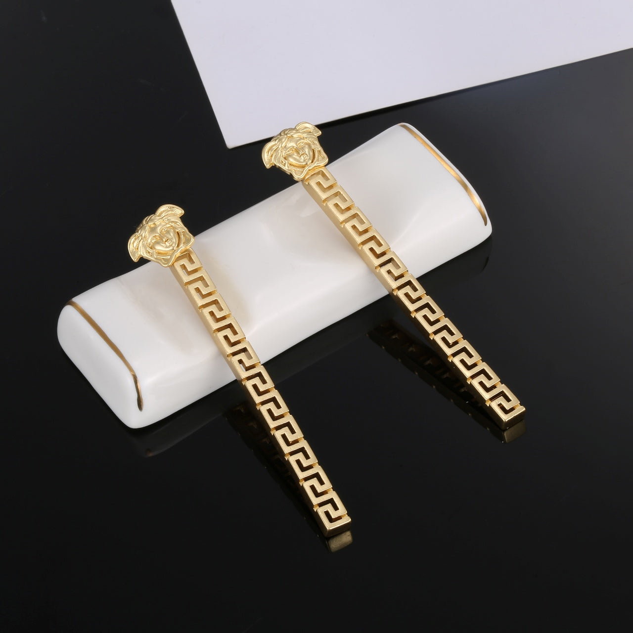 V gold earrings