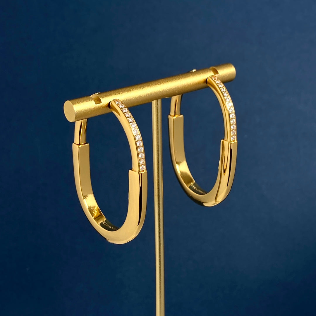 T bangle earrings with diamonds