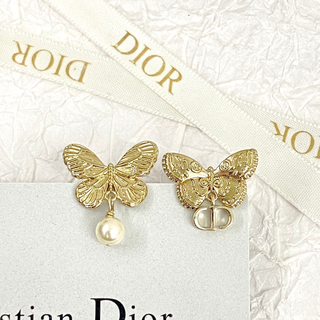 D butterfly logo and pearl earrings