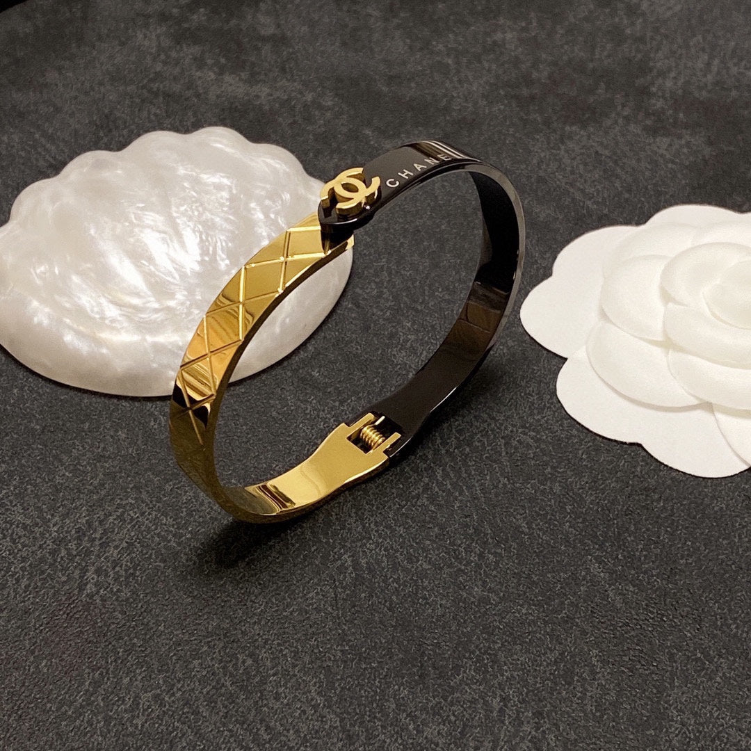 C black and gold bracelet