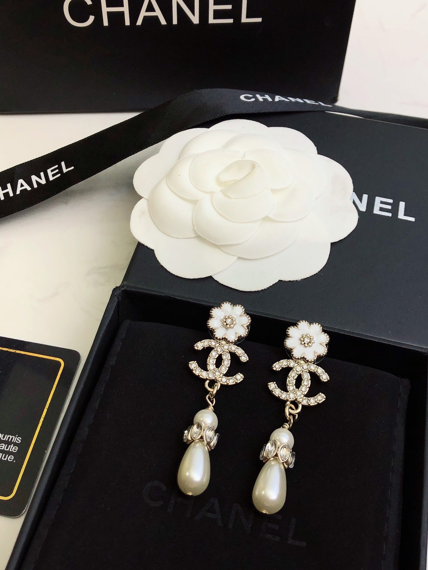 C plower logo and pearl earrings
