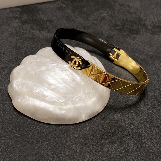 C black and gold bracelet