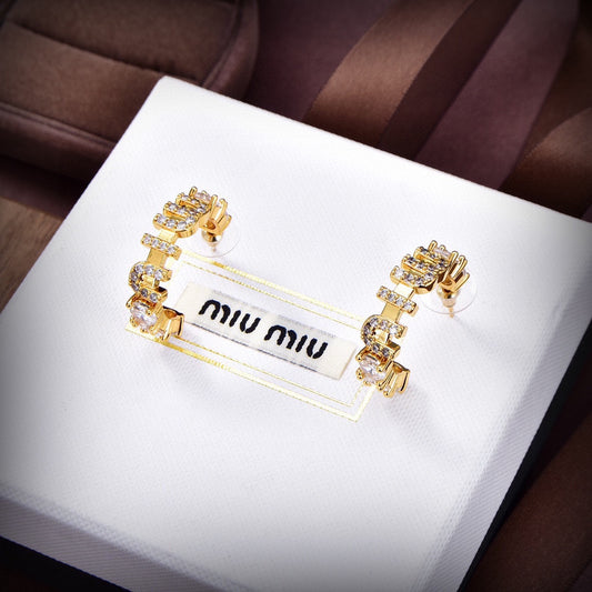 MM rounded logo earrings in gold