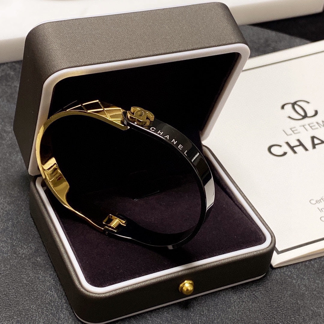 C black and gold bracelet