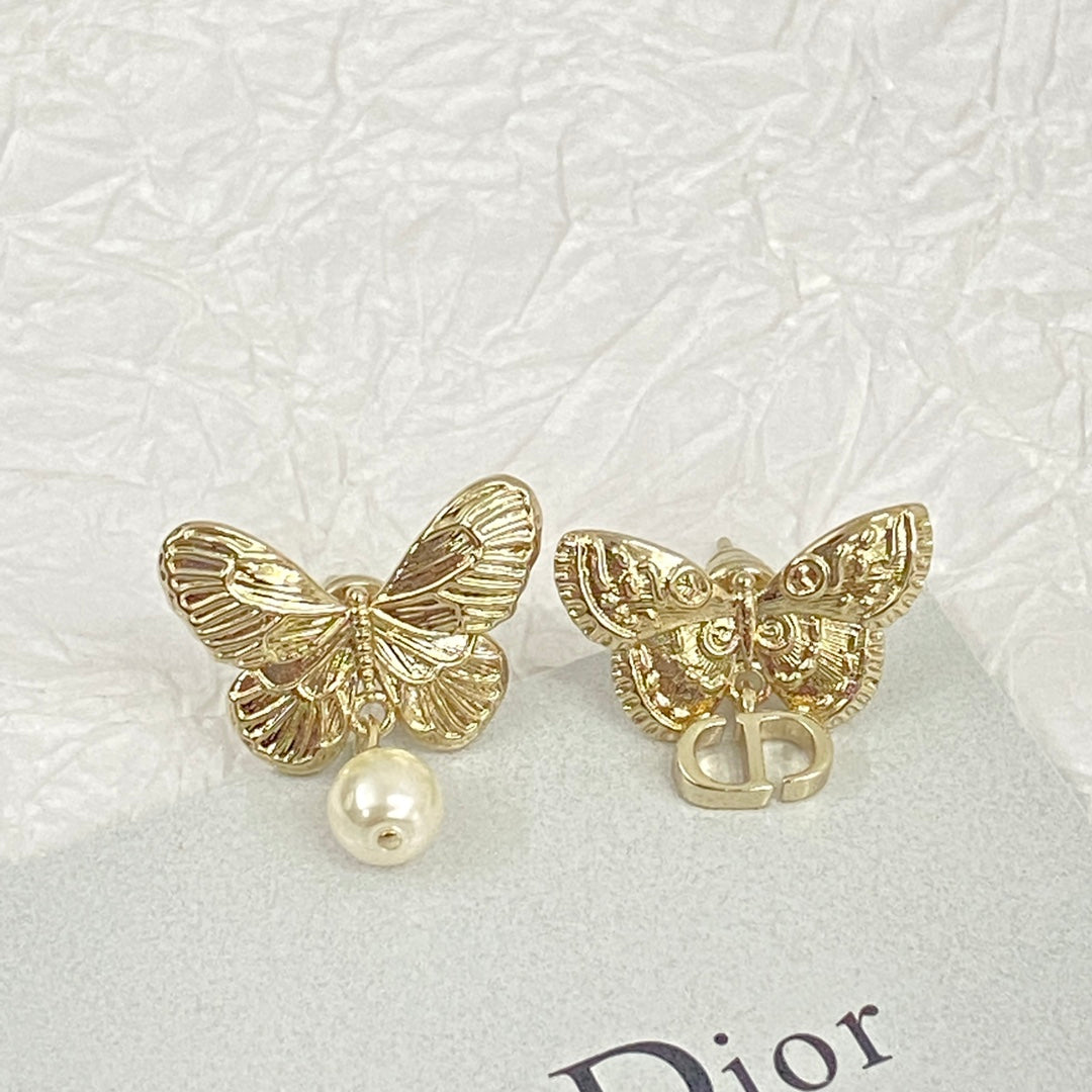D butterfly logo and pearl earrings