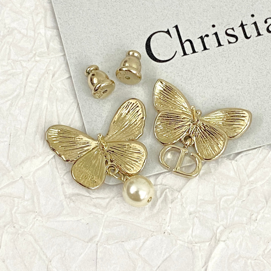 D butterfly logo and pearl earrings