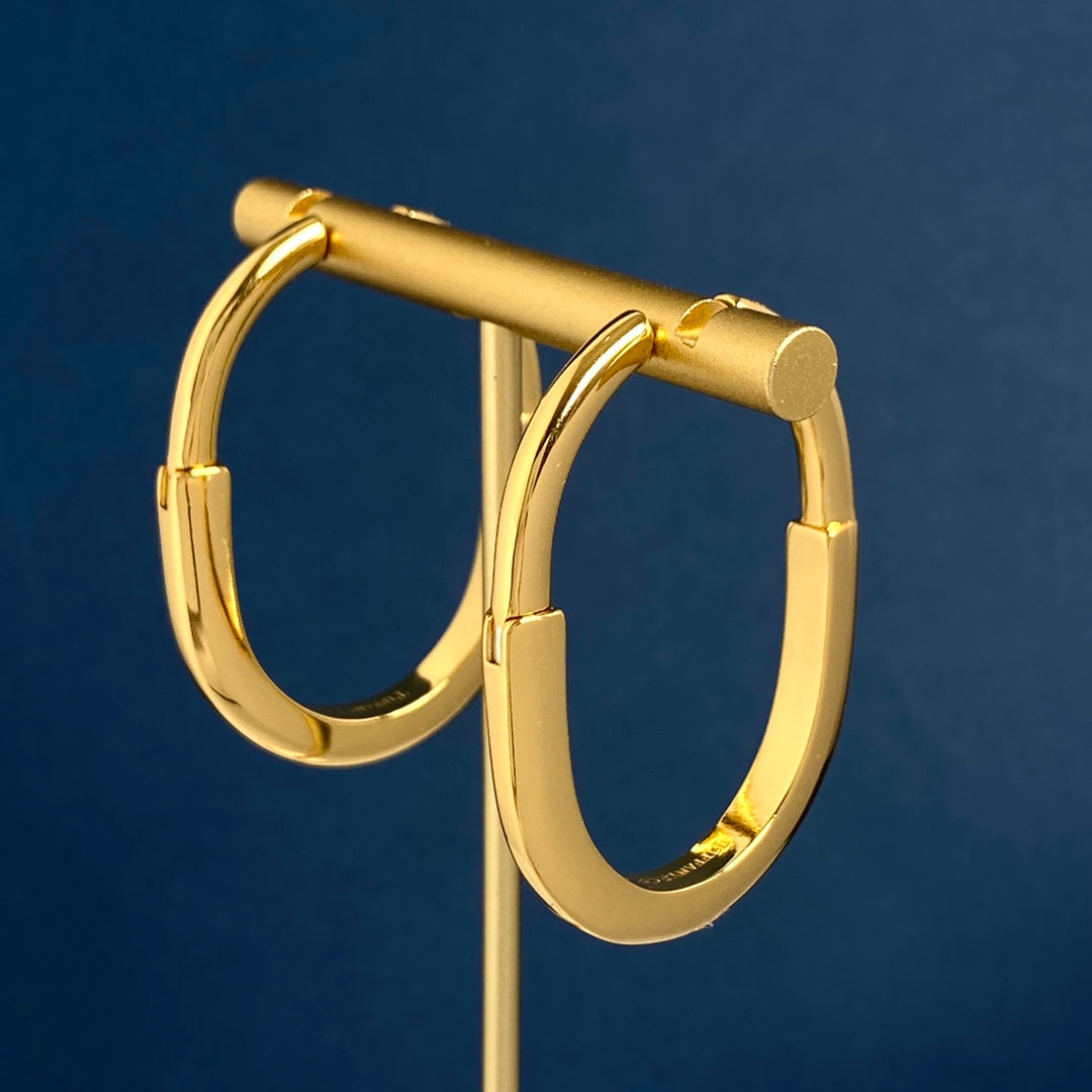 T bangle earrings with diamonds
