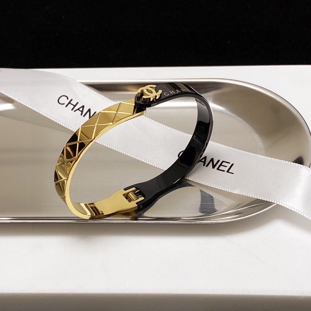 C black and gold bracelet
