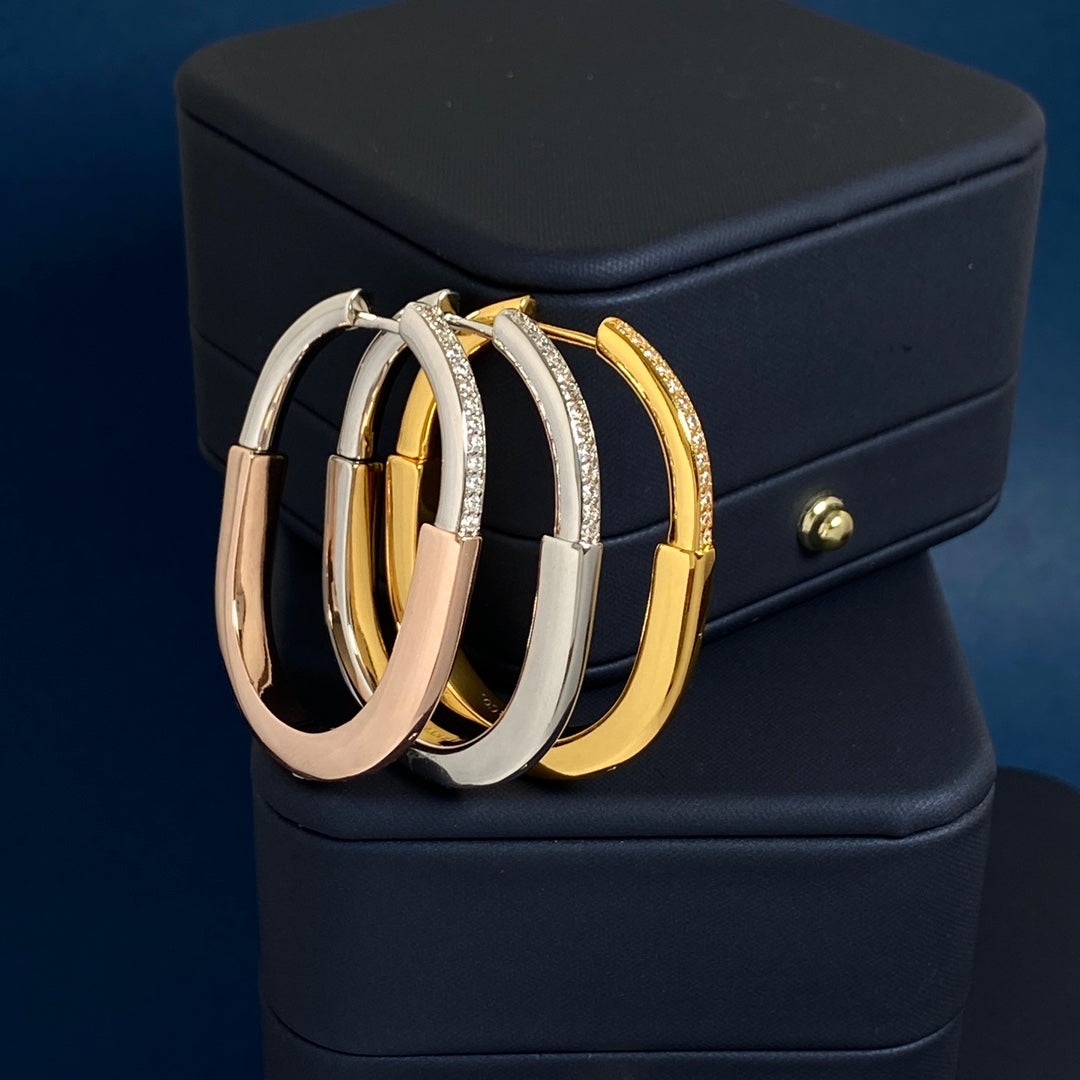 T bangle earrings with diamonds
