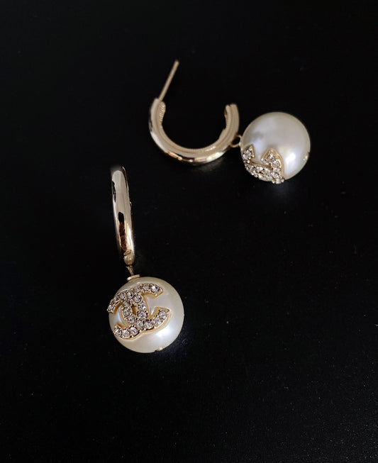 C pearl and gold earrings