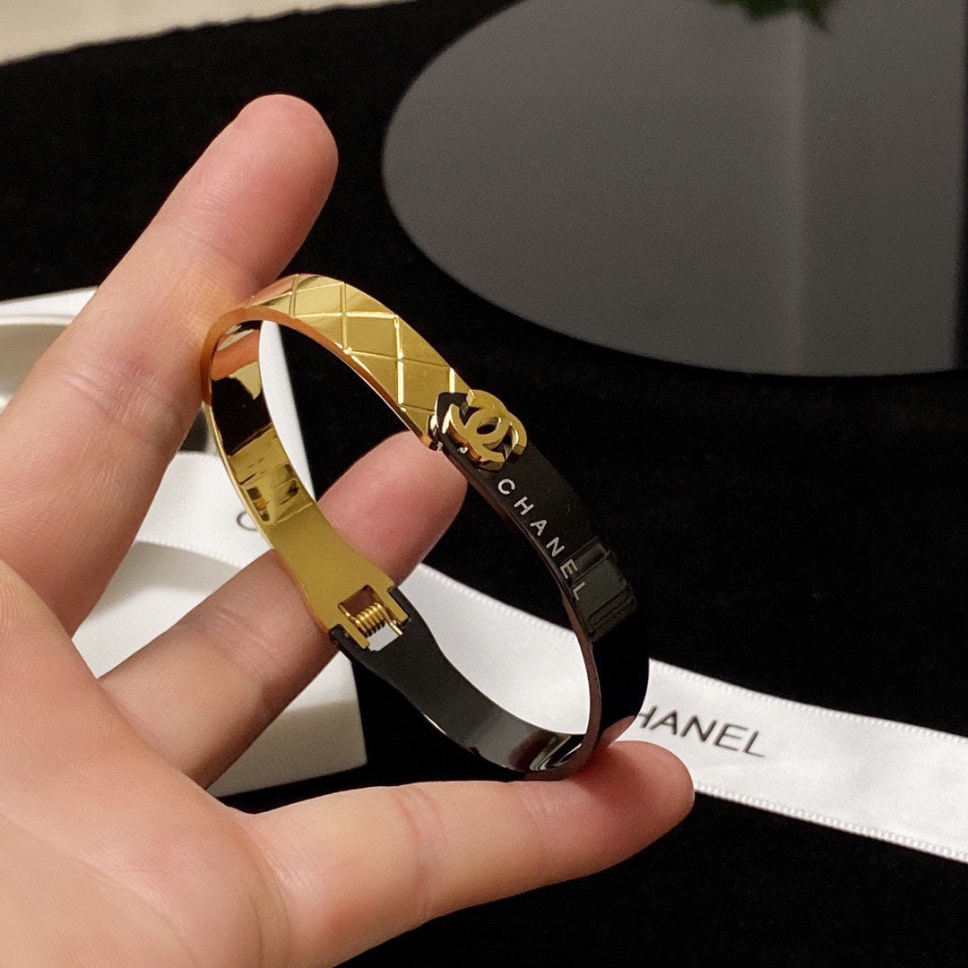 C black and gold bracelet