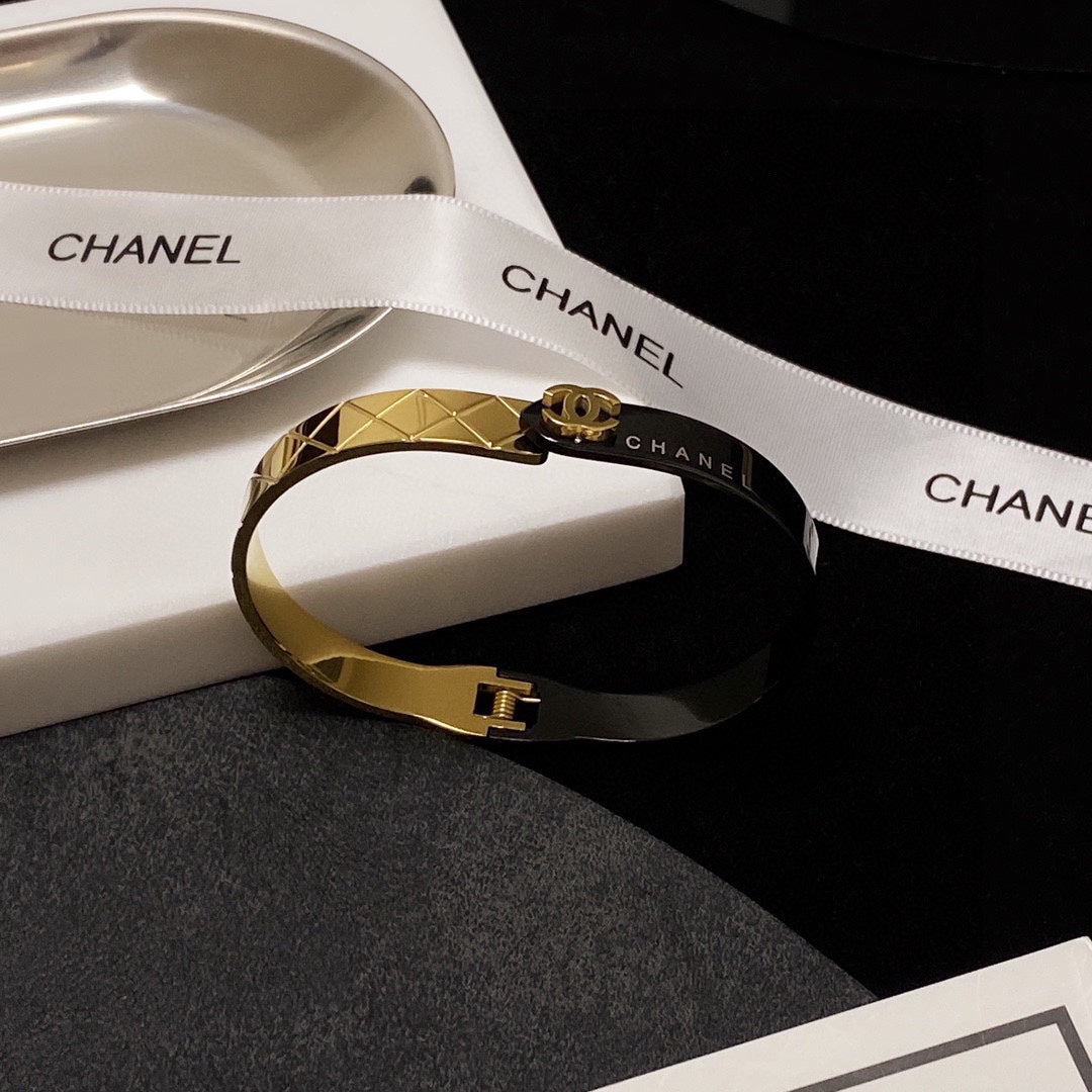 C black and gold bracelet