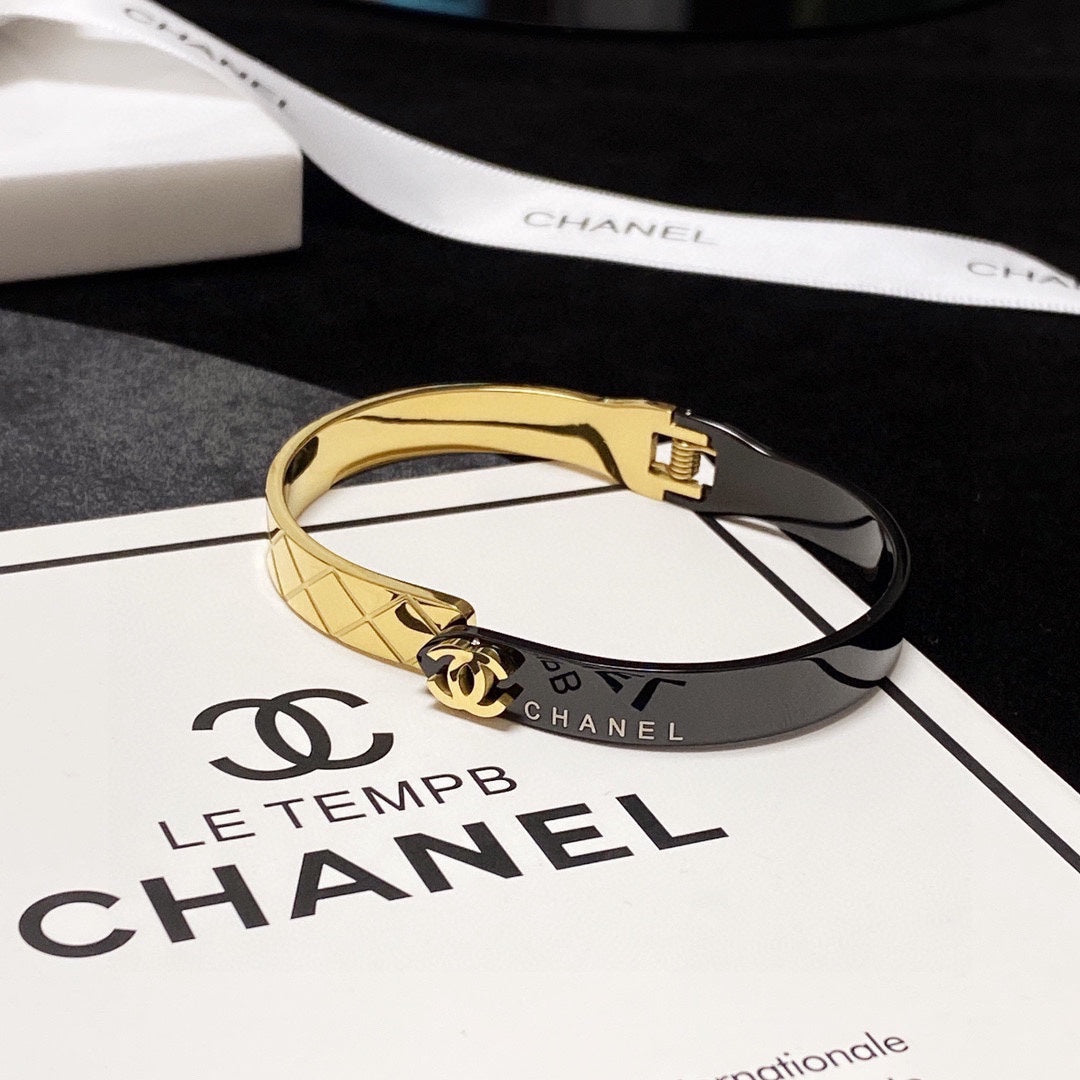 C black and gold bracelet
