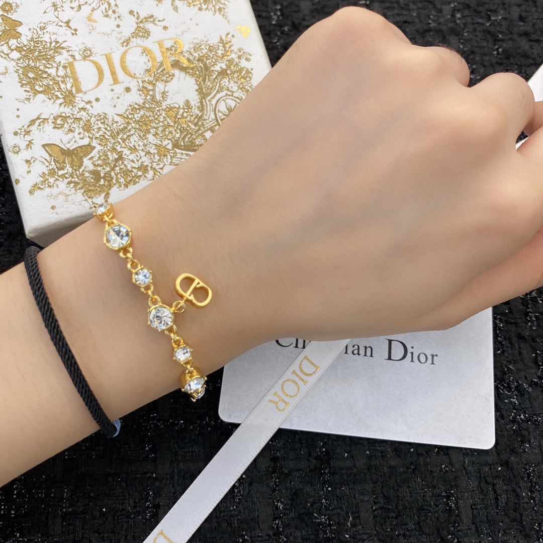 D logo - gold and diamonds bracelet
