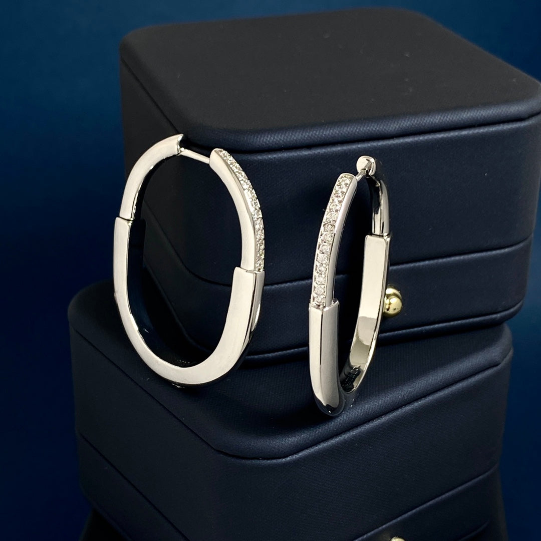 T bangle earrings with diamonds