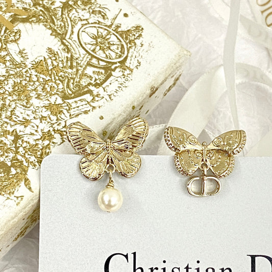 D butterfly logo and pearl earrings