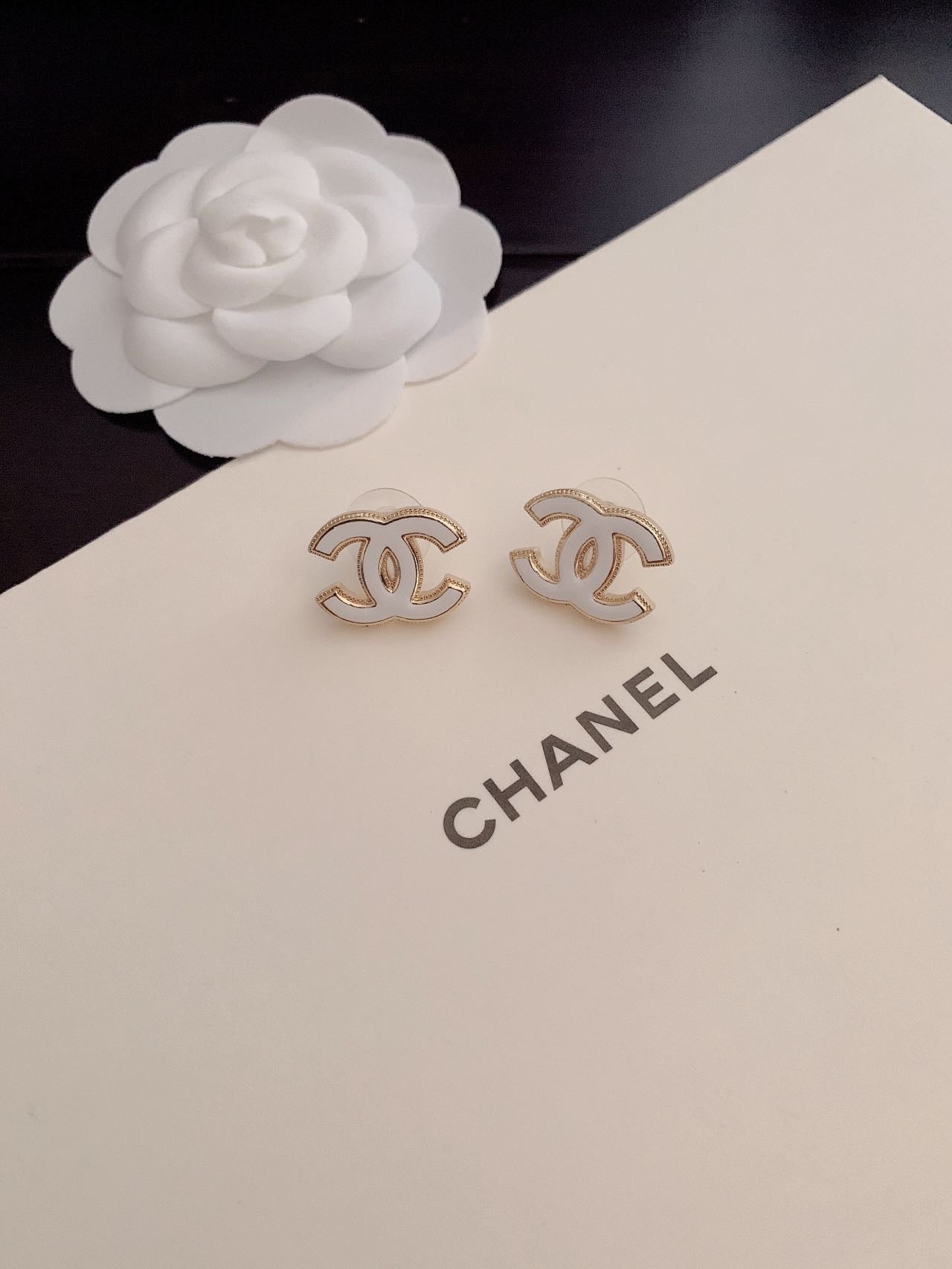 C white logo earrings