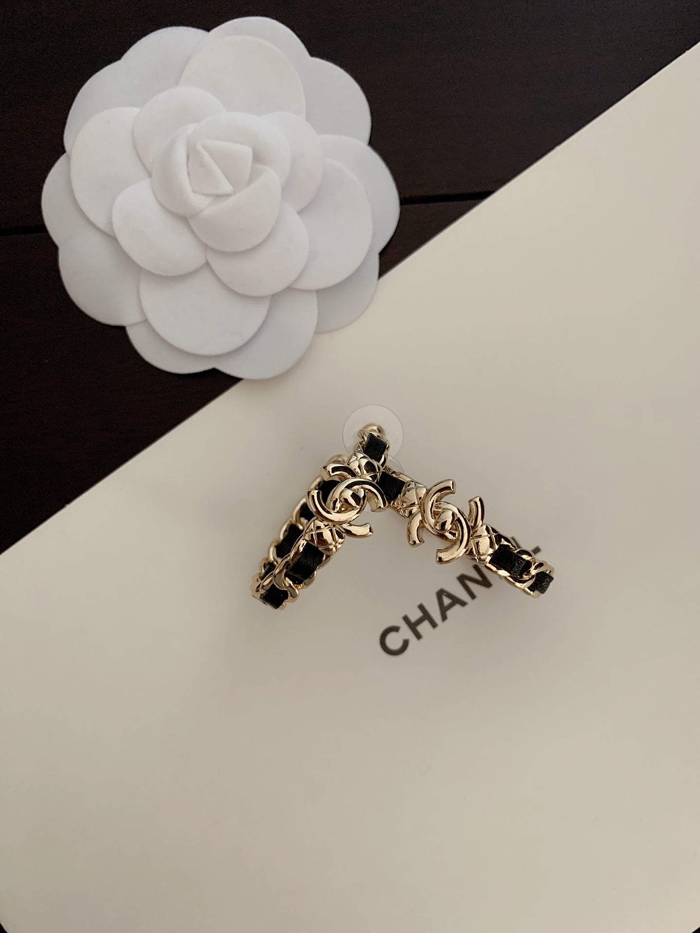 C rounded black earrings