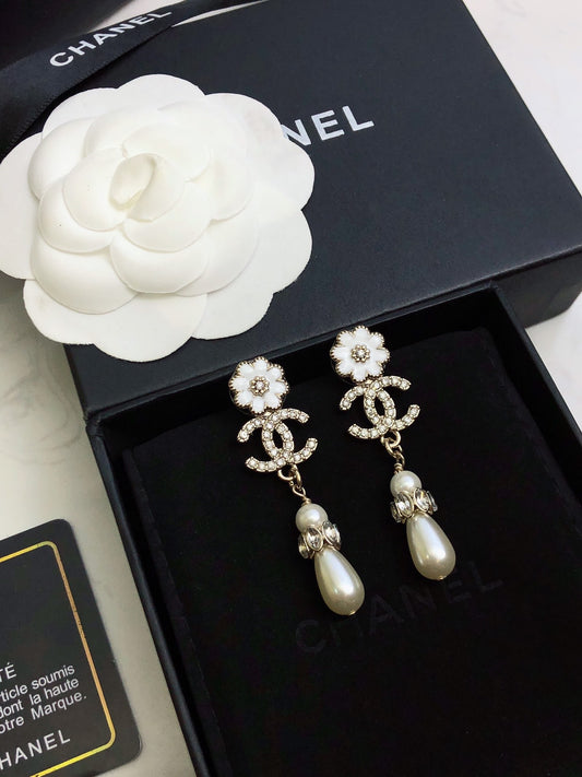 C plower logo and pearl earrings