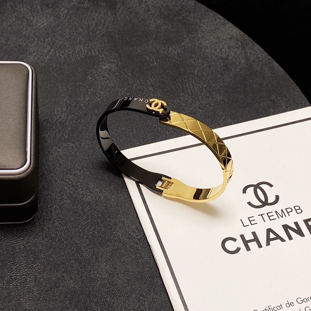C black and gold bracelet
