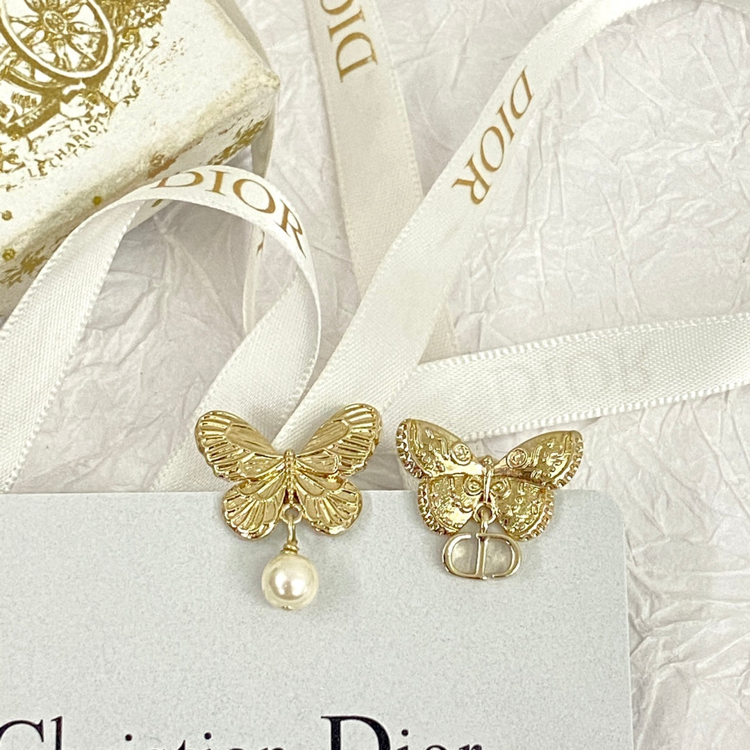 D butterfly logo and pearl earrings