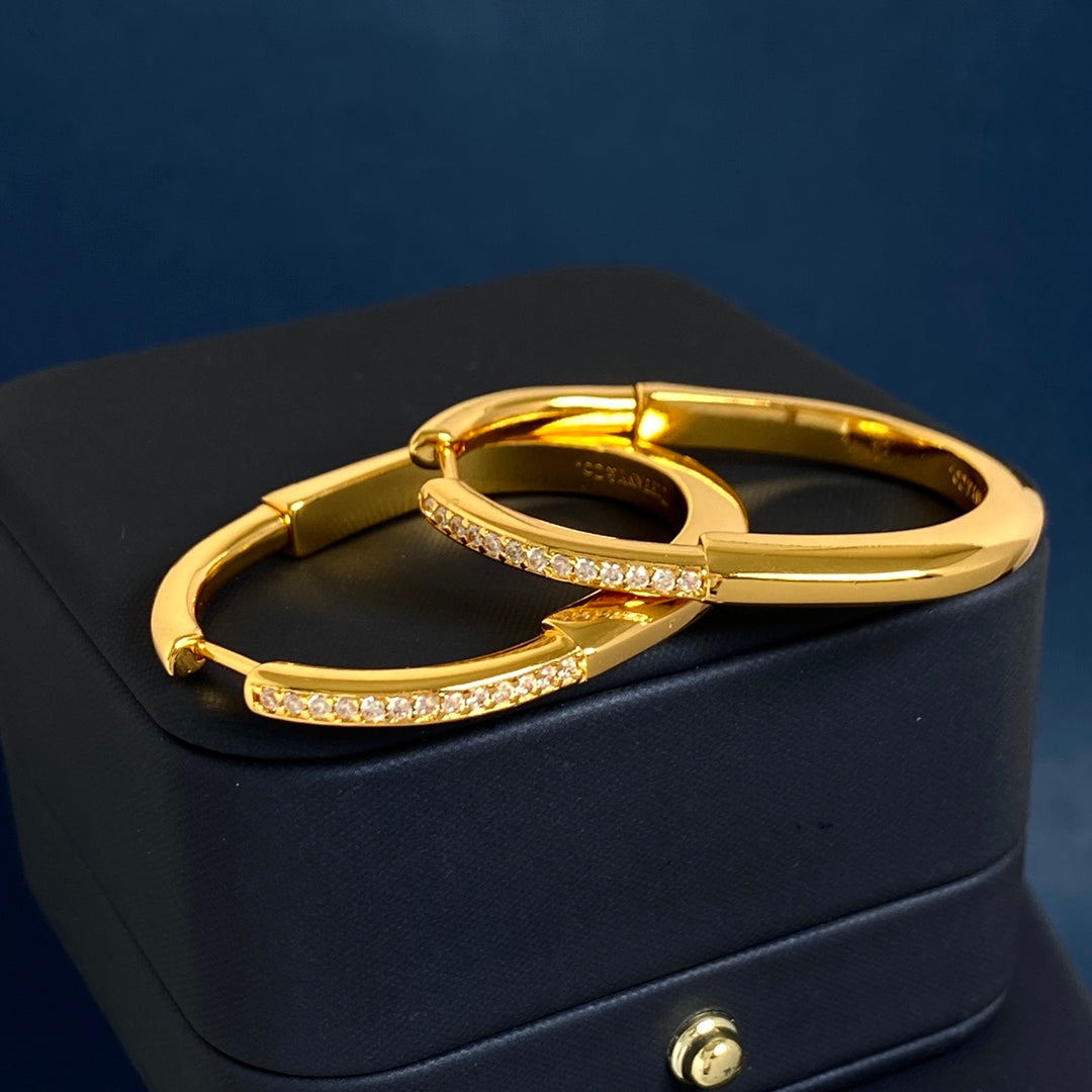 T bangle earrings with diamonds