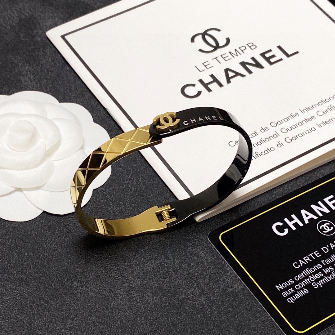 C black and gold bracelet